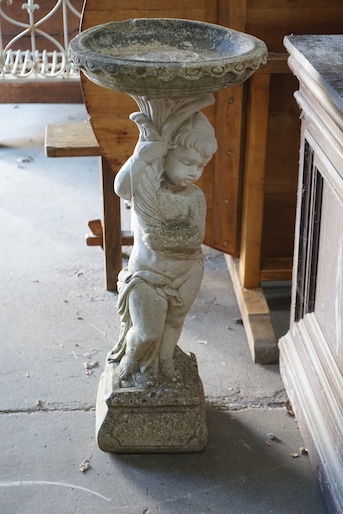 A reconstituted stone figural garden bird bath, height 89cm